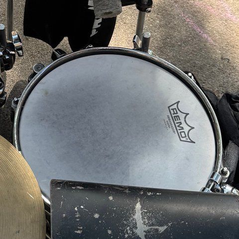 The snare from above, with a white coated REMO drumhead.